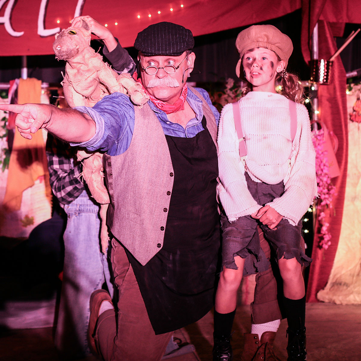 Stephen Bertles as Bartolo, Jane Curry as The Pumpkin Kid and Graham Becerra puppeteering Pluck, the Cat