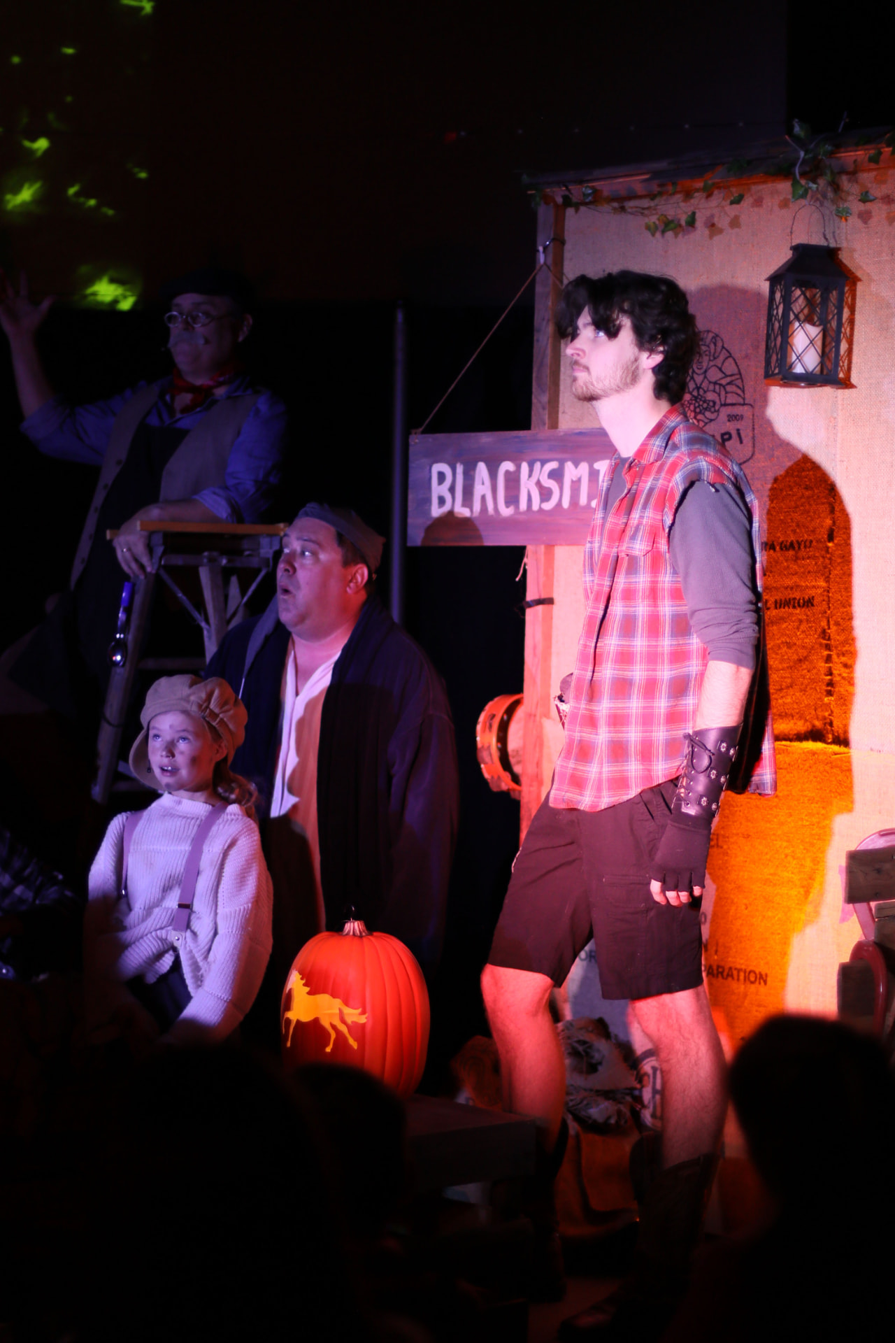 The Blacksmith scene at the Fall Festival, with the Pumpkin Kid and villagers watching